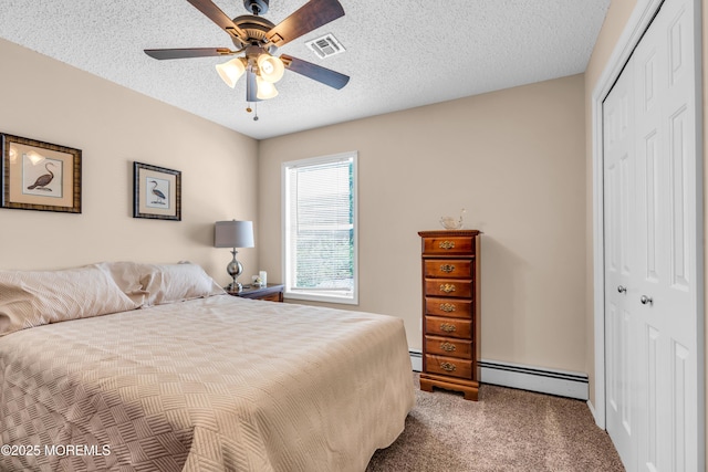 82 Spinnaker Ct, Bayville, NJ 08721 - bedroom with a baseboard heating unit, a closet, carpet flooring, a textured ceiling, and ceiling fan