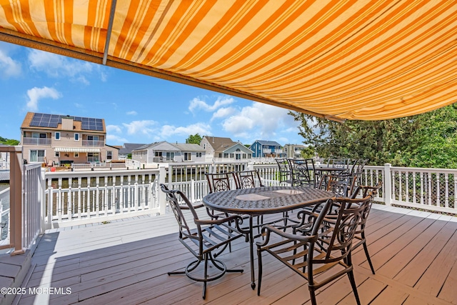 82 Spinnaker Ct, Bayville, NJ 08721 - wooden deck with outdoor dining area and a residential view