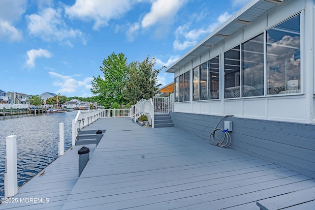 82 Spinnaker Ct, Bayville, NJ 08721 - wooden deck with a sunroom, a water view, and a boat dock