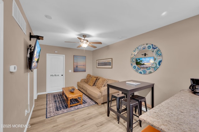 241 Hiering Ave, Seaside Heights, NJ 08751 - living area featuring light wood-style floors and a ceiling fan