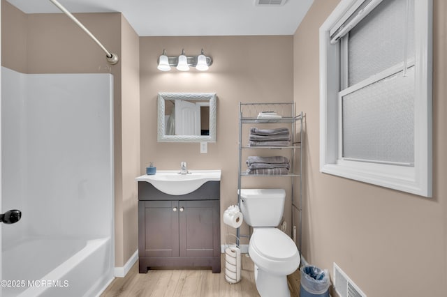241 Hiering Ave, Seaside Heights, NJ 08751 - full bathroom featuring wood finished floors, vanity, and washtub / shower combination