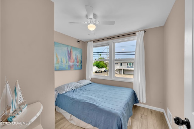 241 Hiering Ave, Seaside Heights, NJ 08751 - bedroom with wood finished floors and a ceiling fan