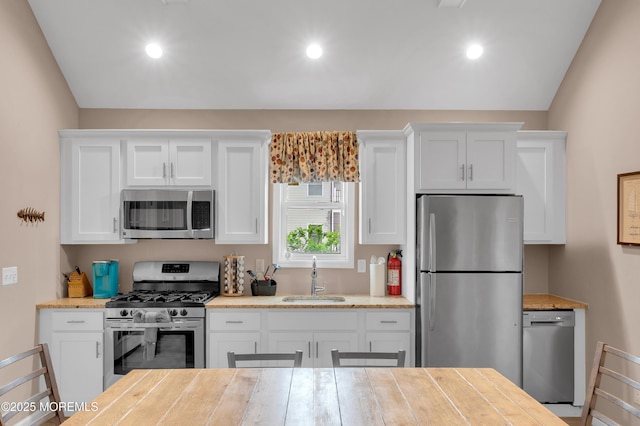 241 Hiering Ave, Seaside Heights, NJ 08751 - kitchen featuring stainless steel appliances, white cabinets, and recessed lighting
