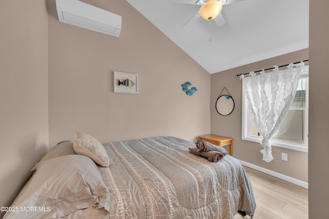 241 Hiering Ave, Seaside Heights, NJ 08751 - bedroom with light wood-type flooring, an AC wall unit, vaulted ceiling, and a ceiling fan