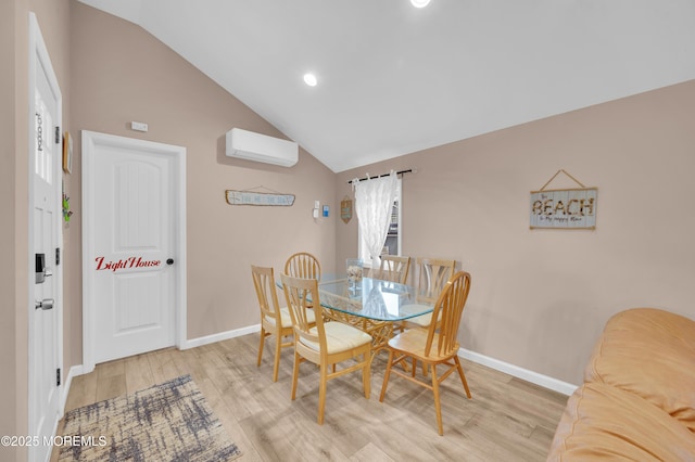 241 Hiering Ave, Seaside Heights, NJ 08751 - dining space with a wall mounted AC, light wood-style floors, high vaulted ceiling, and recessed lighting