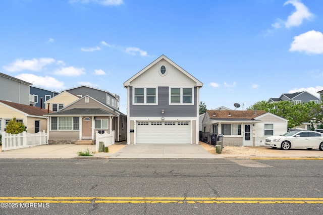 241 Hiering Ave, Seaside Heights, NJ 08751 - traditional-style home featuring a garage, driveway, and board and batten siding