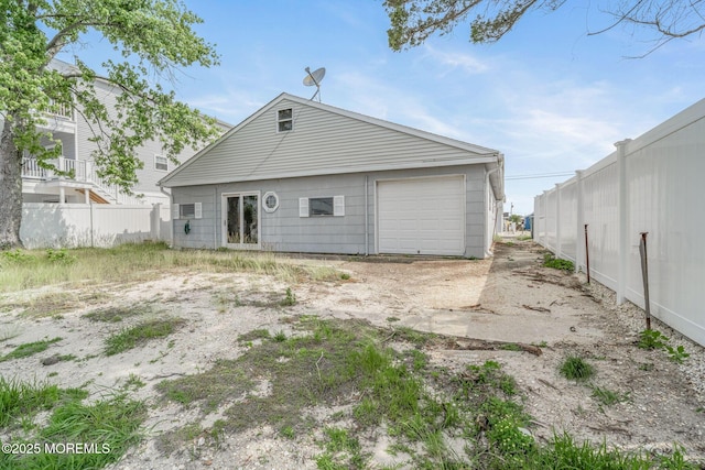 11 W Thames Rd, Little Egg Harbor, NJ 08087 - rear view of house featuring a garage
