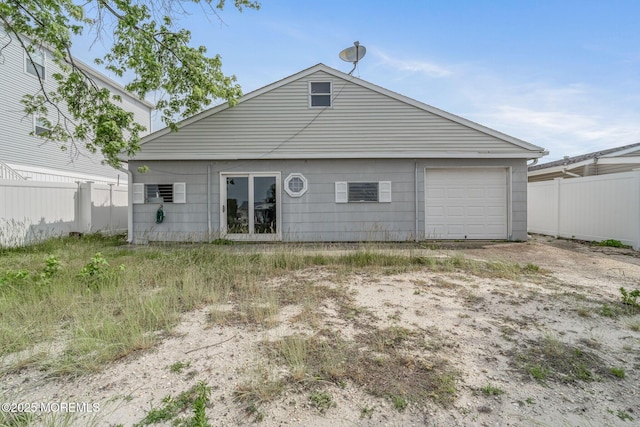 11 W Thames Rd, Little Egg Harbor, NJ 08087 - rear view of property with a garage and driveway