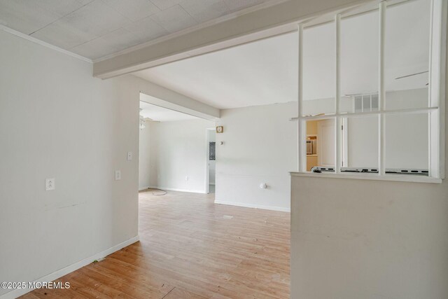 11 W Thames Rd, Little Egg Harbor, NJ 08087 - empty room featuring light wood finished floors and ornamental molding