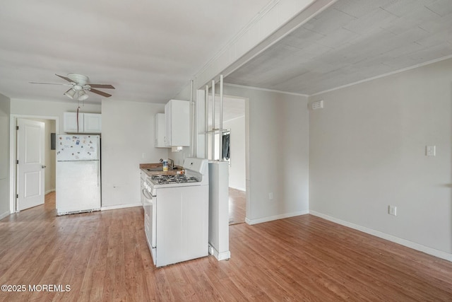 11 W Thames Rd, Little Egg Harbor, NJ 08087 - kitchen featuring white appliances, ceiling fan, light wood-style floors, white cabinets, and ornamental molding