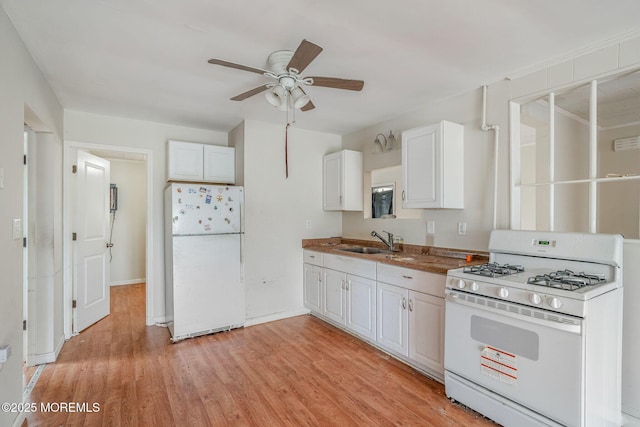 11 W Thames Rd, Little Egg Harbor, NJ 08087 - kitchen featuring white appliances, ceiling fan, white cabinets, light wood-type flooring, and dark countertops