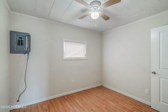 11 W Thames Rd, Little Egg Harbor, NJ 08087 - spare room featuring electric panel, crown molding, ceiling fan, and light wood-type flooring