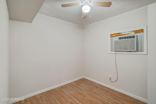 11 W Thames Rd, Little Egg Harbor, NJ 08087 - empty room featuring wood finished floors, a wall unit AC, ornamental molding, and ceiling fan