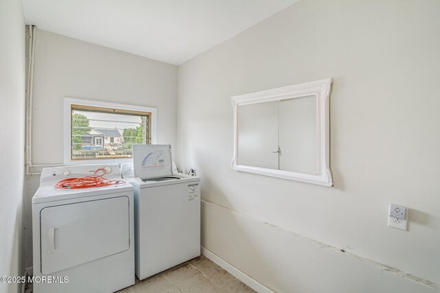 11 W Thames Rd, Little Egg Harbor, NJ 08087 - laundry room with washing machine and clothes dryer and baseboards
