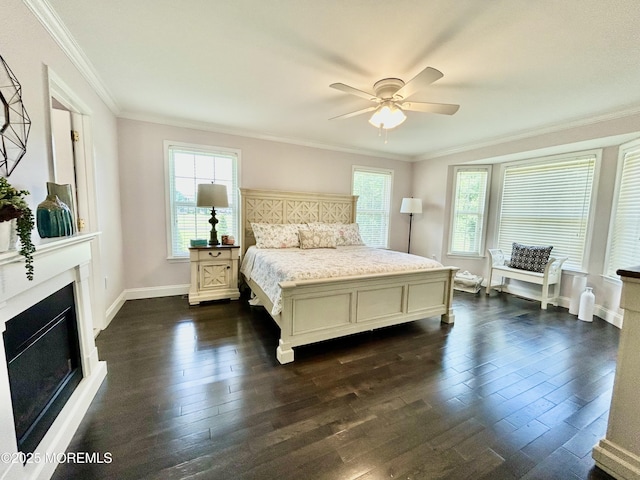 205 Shinnecock Dr, Manalapan, NJ 07726 - bedroom featuring dark wood finished floors, crown molding, a fireplace, and a ceiling fan