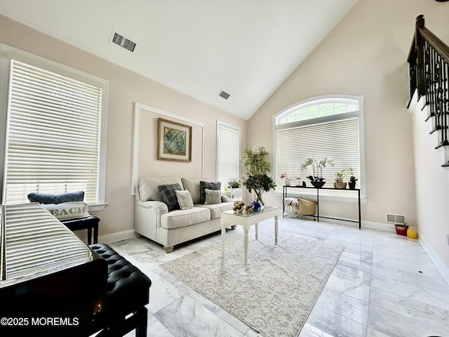 205 Shinnecock Dr, Manalapan, NJ 07726 - living area with marble look tiles and high vaulted ceiling