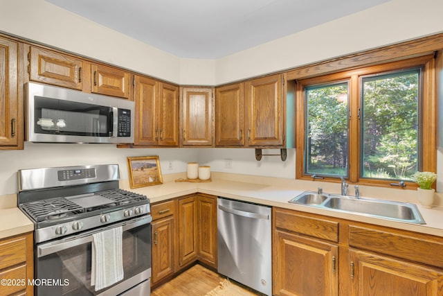 22 Hunt Rd, Freehold, NJ 07728 - kitchen featuring stainless steel appliances, light countertops, and brown cabinetry