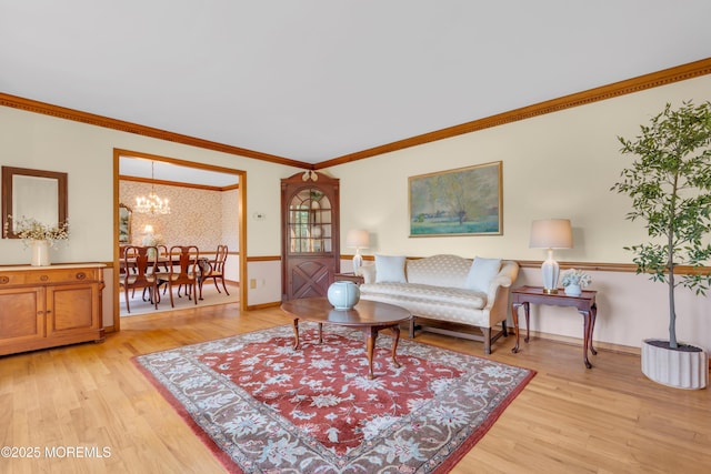 22 Hunt Rd, Freehold, NJ 07728 - living room featuring light wood finished floors, ornamental molding, and a chandelier