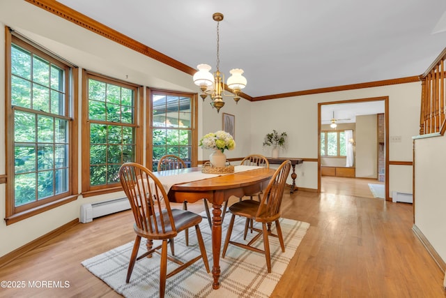 22 Hunt Rd, Freehold, NJ 07728 - dining area with a baseboard radiator, a chandelier, ornamental molding, and light wood-style floors