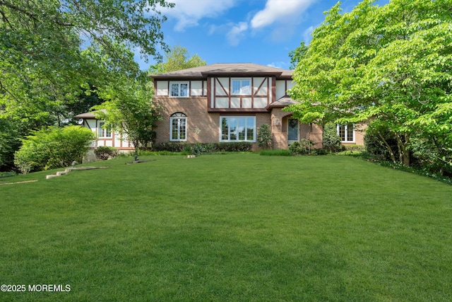 22 Hunt Rd, Freehold, NJ 07728 - rear view of house featuring a lawn and brick siding