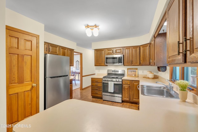 22 Hunt Rd, Freehold, NJ 07728 - kitchen featuring stainless steel appliances, light countertops, wood finished floors, and healthy amount of natural light