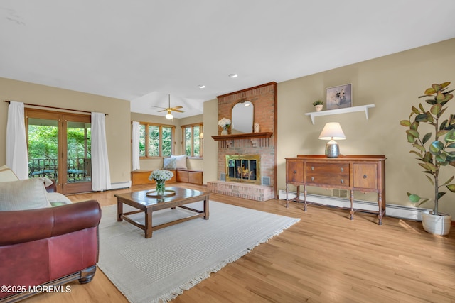22 Hunt Rd, Freehold, NJ 07728 - living area featuring healthy amount of natural light, light wood-style floors, a fireplace, and recessed lighting