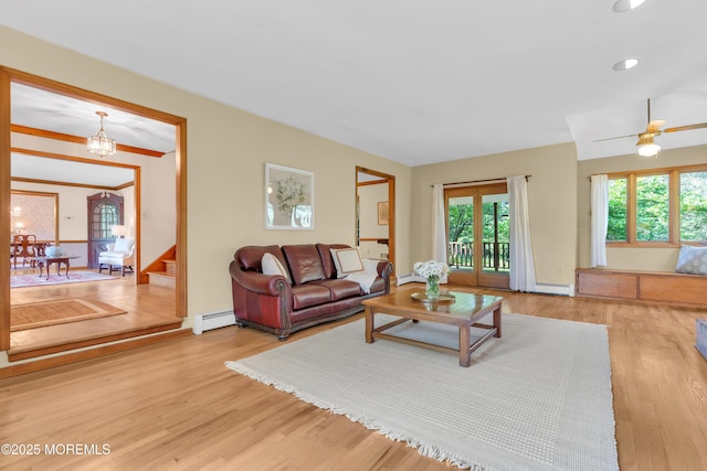22 Hunt Rd, Freehold, NJ 07728 - living area featuring a baseboard radiator, wood finished floors, stairway, and baseboard heating
