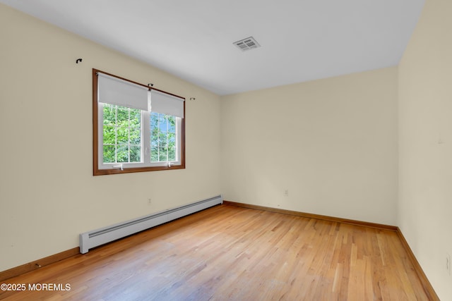 22 Hunt Rd, Freehold, NJ 07728 - empty room featuring baseboard heating and hardwood / wood-style floors