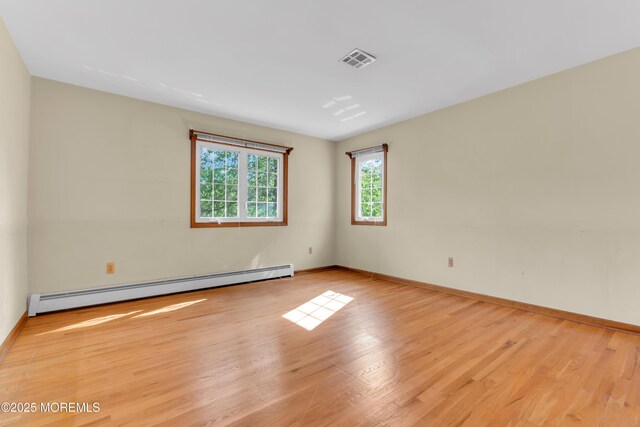 22 Hunt Rd, Freehold, NJ 07728 - empty room featuring a baseboard radiator and wood finished floors