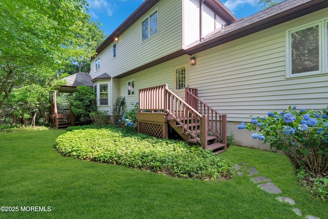 22 Hunt Rd, Freehold, NJ 07728 - rear view of property with a lawn and a wooden deck
