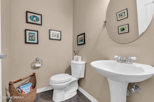 134 Marina Bay Ct, Highlands, NJ 07732 - half bathroom with toilet and wood finished floors