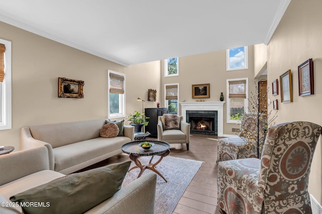 134 Marina Bay Ct, Highlands, NJ 07732 - living room with a warm lit fireplace, wood finished floors, and ornamental molding