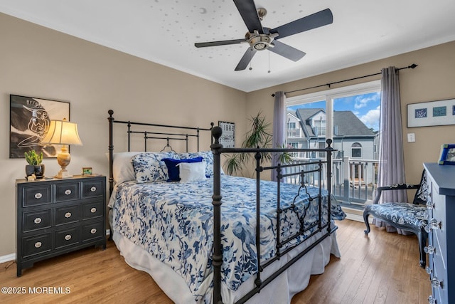 134 Marina Bay Ct, Highlands, NJ 07732 - bedroom featuring wood finished floors, access to exterior, and ceiling fan