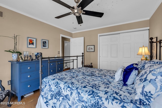 134 Marina Bay Ct, Highlands, NJ 07732 - bedroom featuring dark wood-style floors, ornamental molding, a closet, and ceiling fan