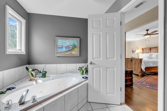 134 Marina Bay Ct, Highlands, NJ 07732 - bathroom featuring a tub with jets, ensuite bath, and a ceiling fan