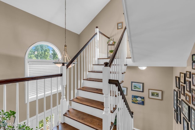 134 Marina Bay Ct, Highlands, NJ 07732 - staircase featuring a chandelier and a high ceiling
