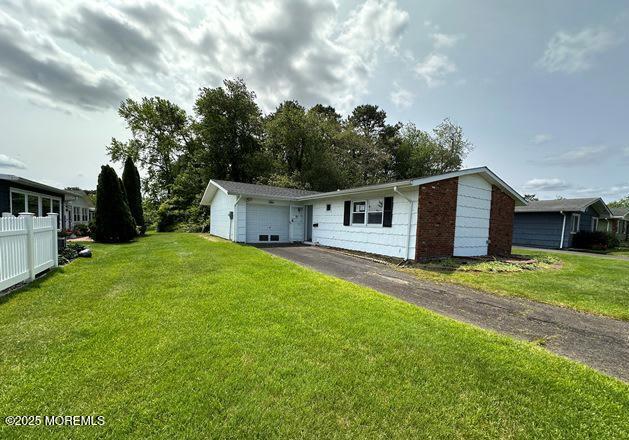 10 Arnold St, Brick, NJ 08724 - view of front of property featuring asphalt driveway and an attached garage