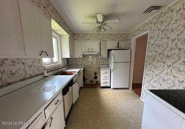 10 Arnold St, Brick, NJ 08724 - kitchen featuring freestanding refrigerator, under cabinet range hood, ceiling fan, light floors, and light countertops