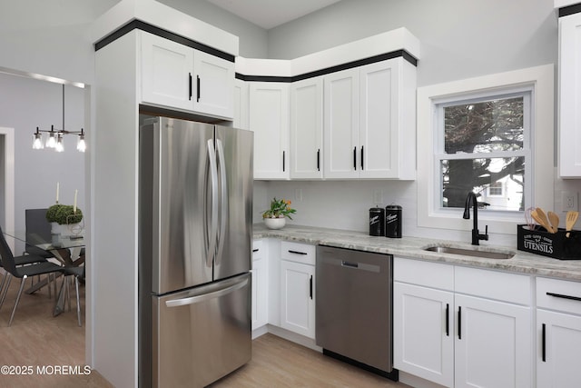 623 Central Ave, Union Beach, NJ 07735 - kitchen featuring stainless steel appliances, light wood-style flooring, and white cabinetry