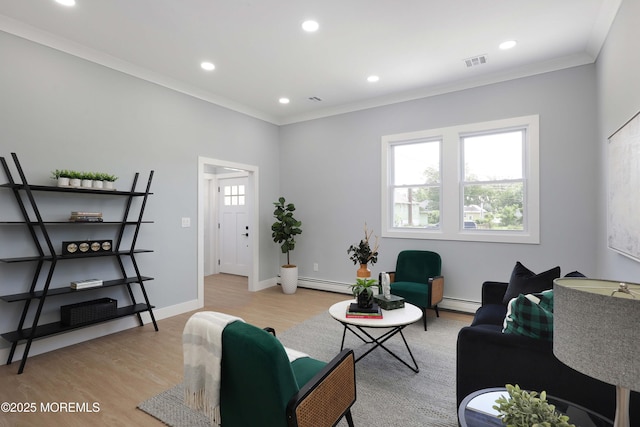 623 Central Ave, Union Beach, NJ 07735 - living room featuring light wood-style floors, a baseboard heating unit, ornamental molding, and recessed lighting