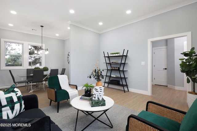 623 Central Ave, Union Beach, NJ 07735 - living room with ornamental molding, light wood finished floors, a chandelier, recessed lighting, and a baseboard radiator