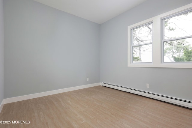 623 Central Ave, Union Beach, NJ 07735 - unfurnished room featuring baseboard heating and wood finished floors