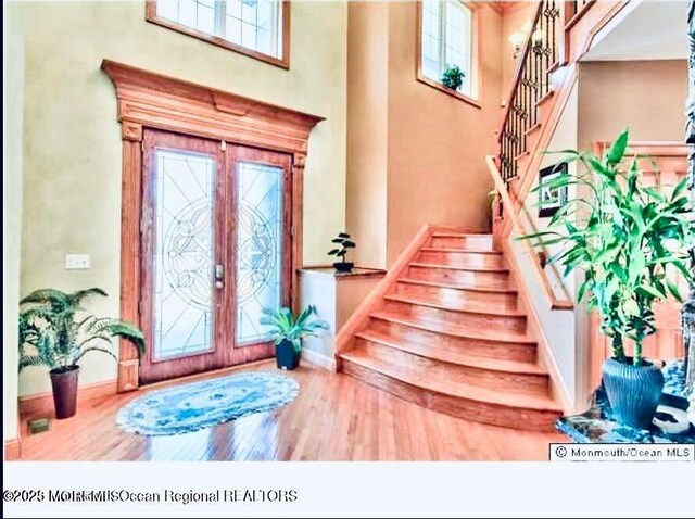 6 Meadow Run Ct, Jackson, NJ 08527 - foyer with a high ceiling, wood finished floors, stairway, and french doors