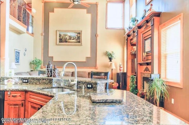 6 Meadow Run Ct, Jackson, NJ 08527 - kitchen with ceiling fan, light stone countertops, and a high ceiling