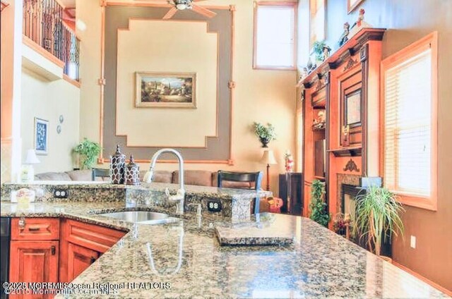 6 Meadow Run Ct, Jackson, NJ 08527 - kitchen with ceiling fan, light stone countertops, and a high ceiling