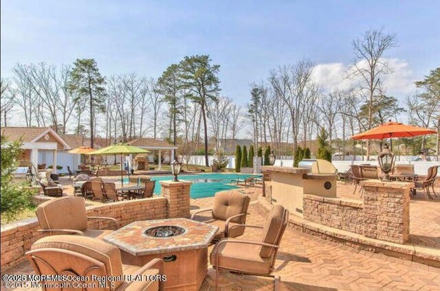 6 Meadow Run Ct, Jackson, NJ 08527 - view of swimming pool with a fire pit, a patio, area for grilling, and a bar