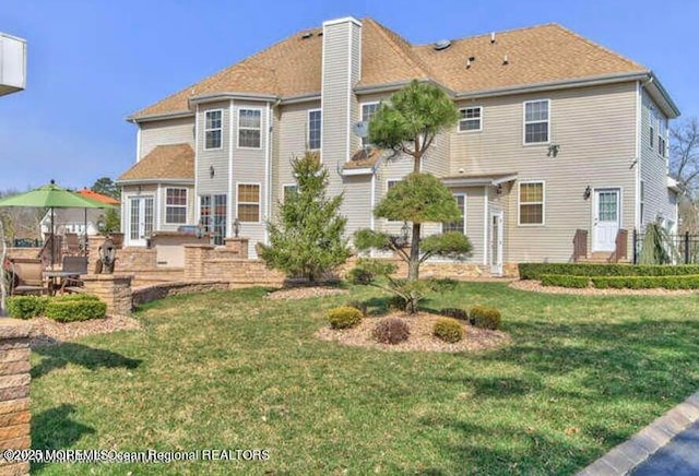 6 Meadow Run Ct, Jackson, NJ 08527 - back of house featuring a yard, a chimney, and a patio