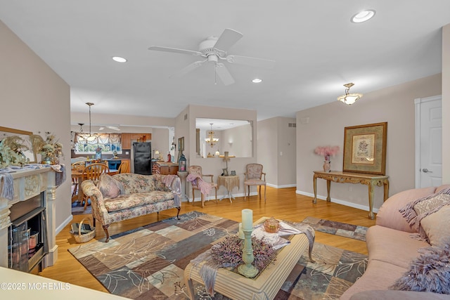2 Apache Dr, Toms River, NJ 08753 - living area with a chandelier, light wood-style flooring, recessed lighting, and a ceiling fan