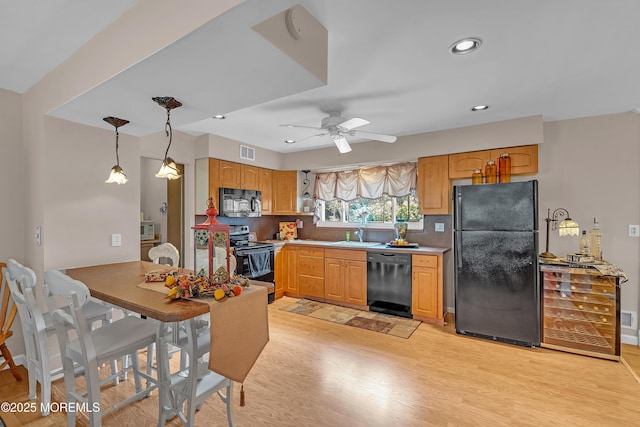 2 Apache Dr, Toms River, NJ 08753 - kitchen featuring black appliances, light wood-style flooring, decorative backsplash, decorative light fixtures, and recessed lighting