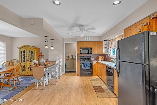2 Apache Dr, Toms River, NJ 08753 - kitchen with black appliances, a ceiling fan, light wood-type flooring, recessed lighting, and light countertops